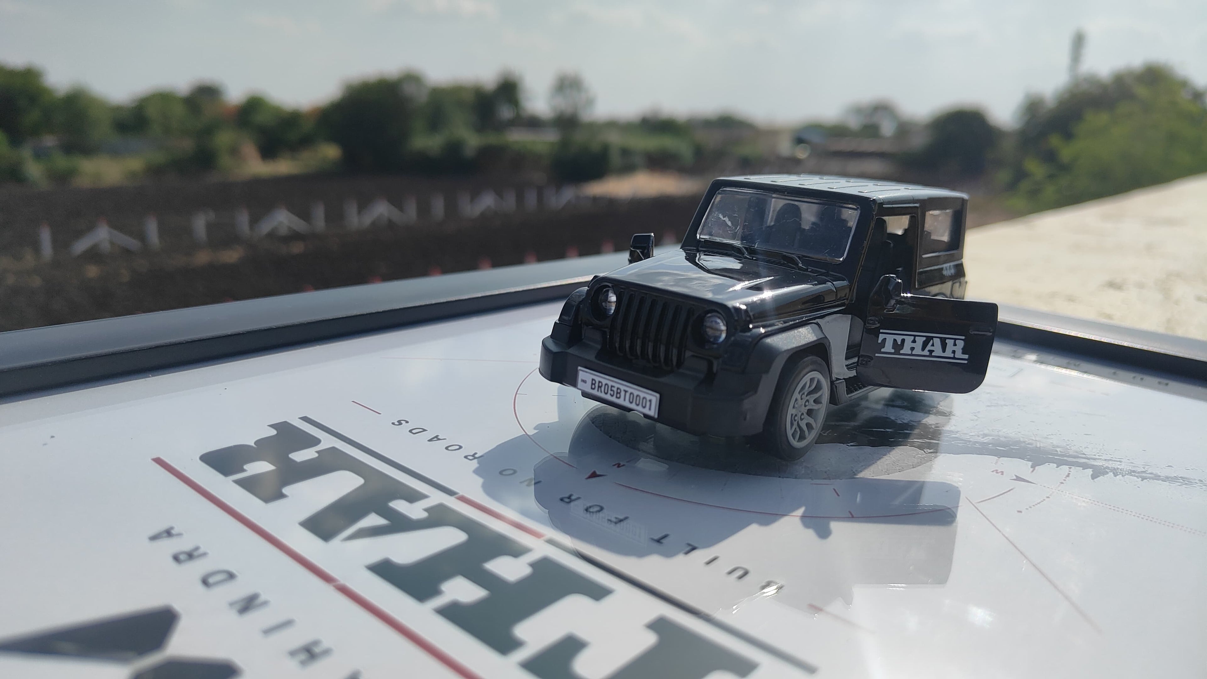 Mahindra Thar matte black die-cast model close-up with opening doors