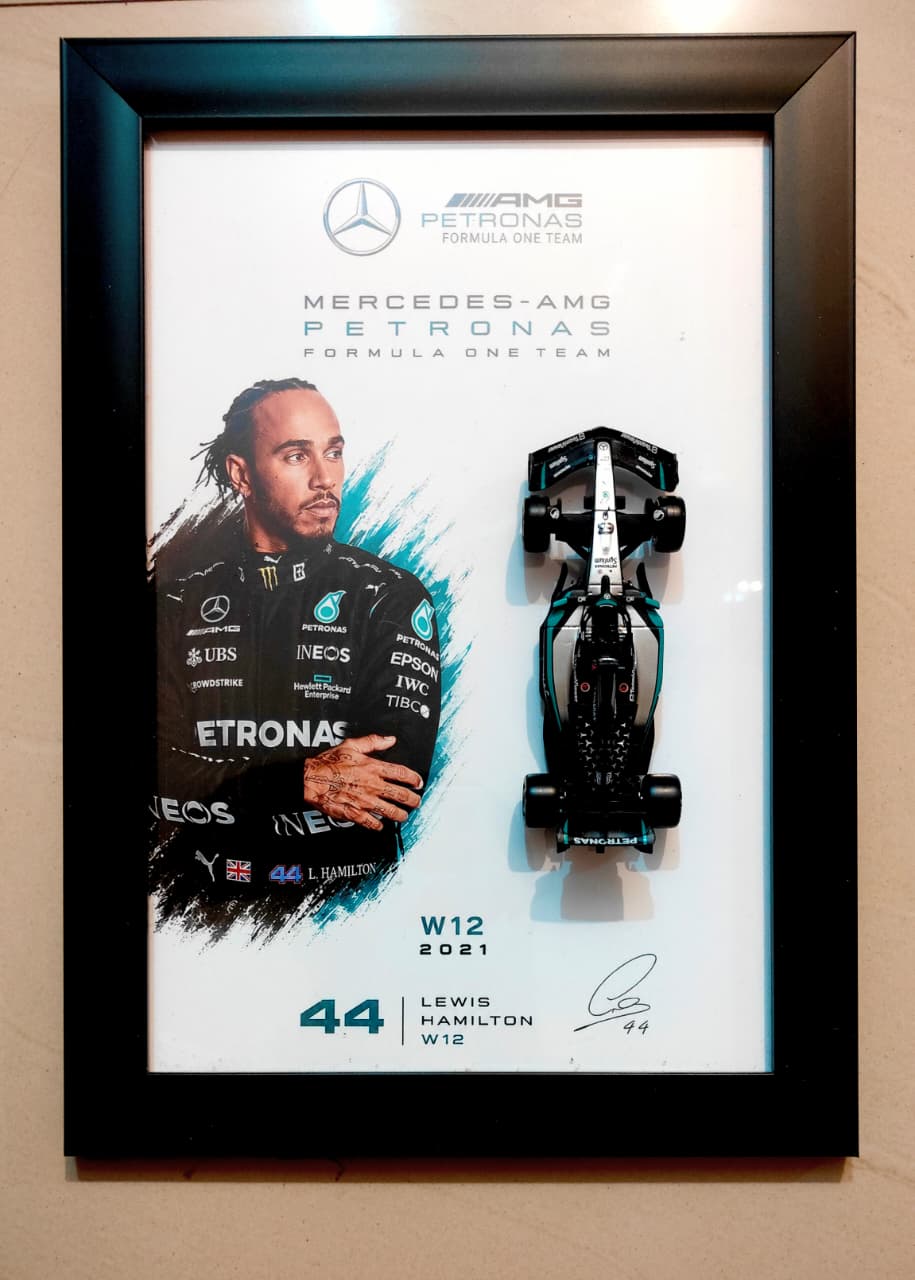 Bburago Mercedes-AMG Petronas Lewis Hamilton #44 W12 2021 framed poster with driver portrait and die-cast model